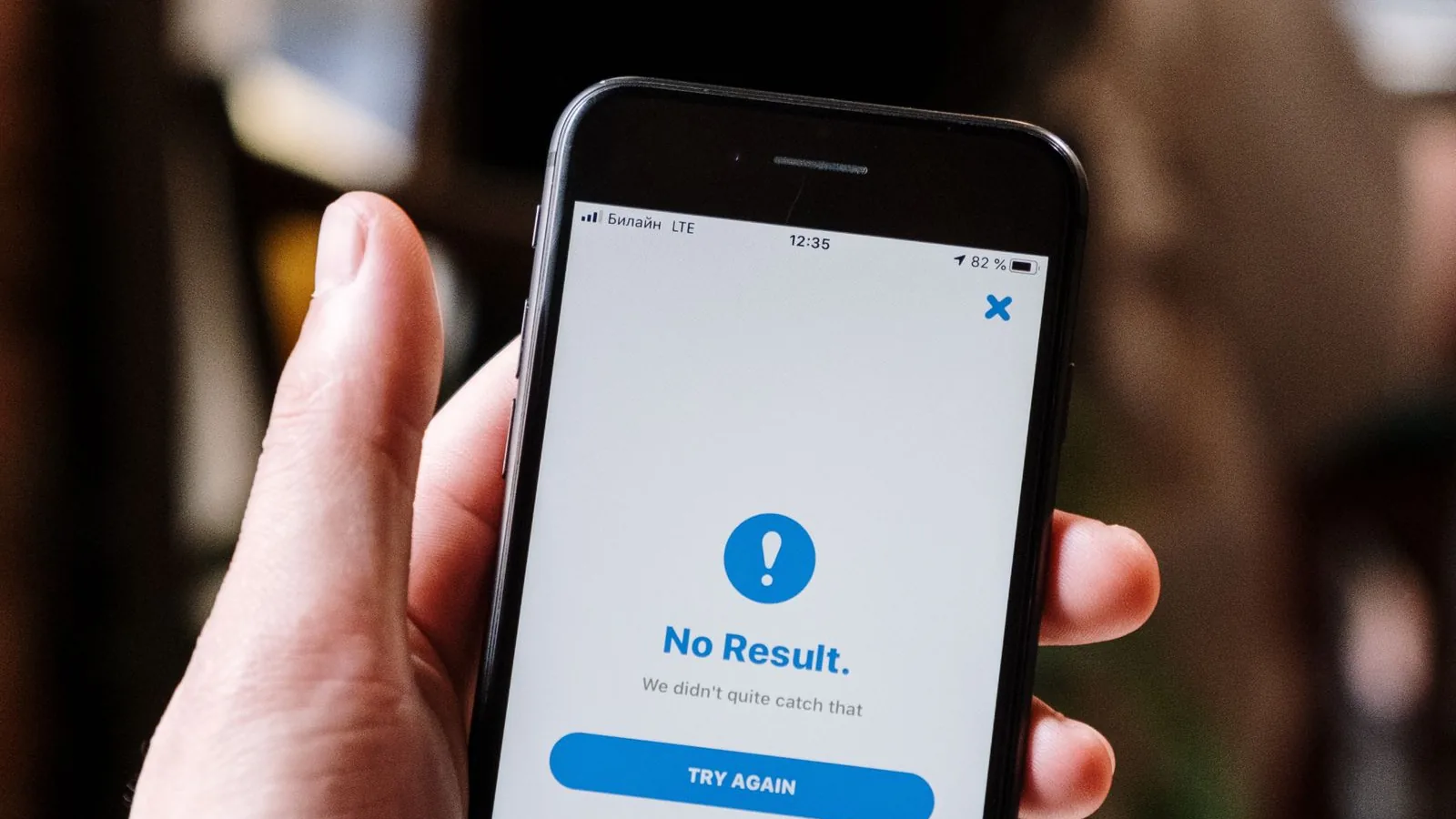 A hand holding a phone showing a notification